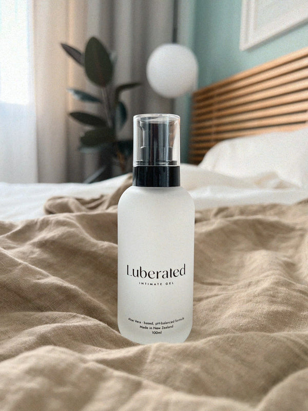 Luberated natural lubricant bottle sitting in the bedroom